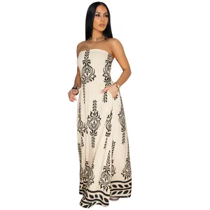 Elegant strapless maxi jumpsuit with black placement print and functional side pockets.