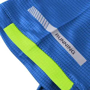 Close-up of reflective running strip and breathable mesh fabric on men's sports t-shirt