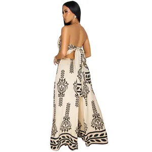 Back view of a strapless wide-leg jumpsuit featuring ethnic print and a large back bow tie.