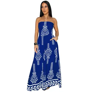 Elegant royal blue strapless wide-leg jumpsuit with white damask print and pockets.