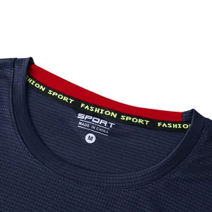 Macro detail shot of the dark blue quick-dry sports t-shirt neckline with mesh texture