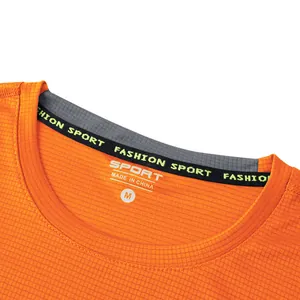 Close-up detail of orange mens quick dry sport t-shirt neckline with grid texture
