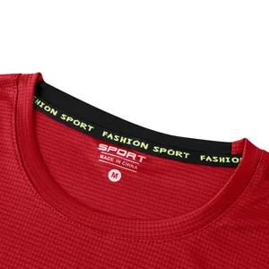 Close-up detail of red quick-dry sports t-shirt neckline and honeycomb texture