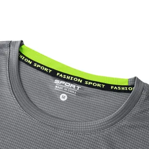 Detailed macro shot of grey men's quick-dry sport T-shirt collar with neon trim