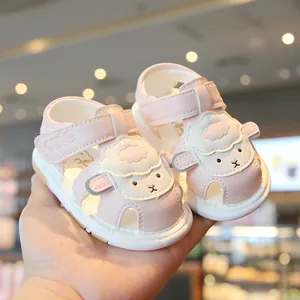 Cute pink infant sandals with soft soles and cartoon sheep design for toddlers walking