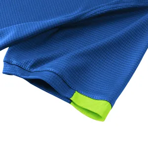 Close-up detail of blue ice silk mesh T-shirt with neon green inner trim stitching