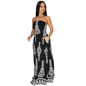 Full body view of a woman wearing a black and white printed strapless jumpsuit