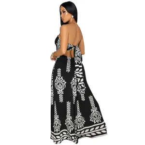 Back view detail of women's strapless black and white floral print wide-leg jumpsuit