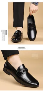 Close-up of men's black leather loafers with metal buckle for business formal wear