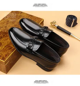 Close-up of premium black leather loafers with metal buckle and British style detail