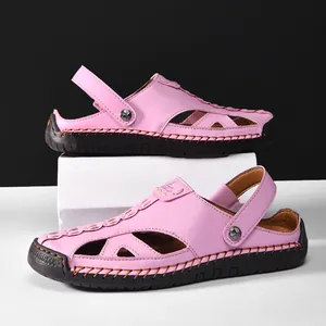 Close-up detail of pink hollow-out leather sandals featuring an adjustable heel strap for casual wear
