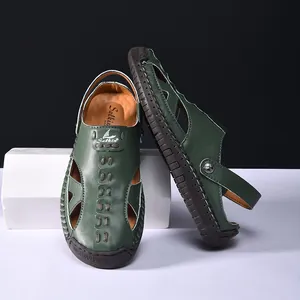 Close-up detail of dark green outdoor hollow-out sandals featuring a durable rubber toe cap