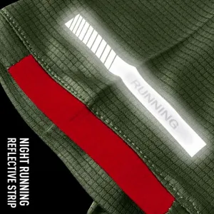 Close-up of the reflective night running strip on a green quick-dry sports t-shirt