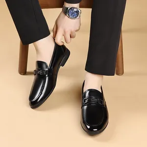Premium black genuine leather loafers for men with elegant metal buckle decoration