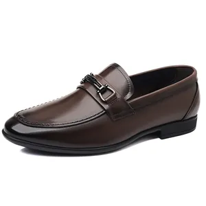 Classic dark brown men's leather loafers with decorative metal bit and polished finish