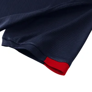 Detailed macro shot showing breathable waffle texture and red trim on navy running t-shirt