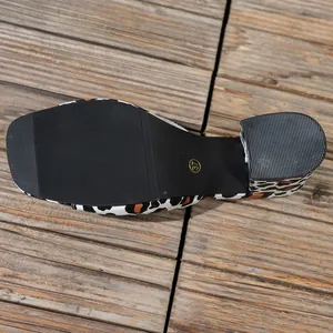 Detailed view of the anti-slip black outsole on a leopard print block heel sandal.