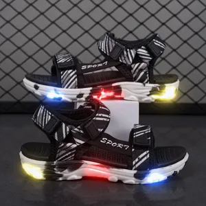Sandalias LED para niños con estampado de cebra blanco y negro y suela luminosa