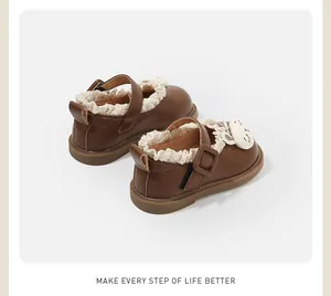 Rear view of brown girls' Mary Jane princess shoes with lace trim and cartoon rabbit detail