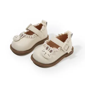 Adorable cream toddler girls Mary Jane shoes with lace trim and cute rabbit head decoration