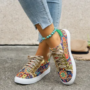 Bohemian printed canvas sneakers with glittery gold laces and white rubber soles