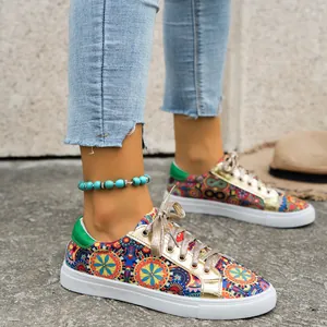 Vibrant bohemian mandala print canvas sneakers with gold metallic accents for women.