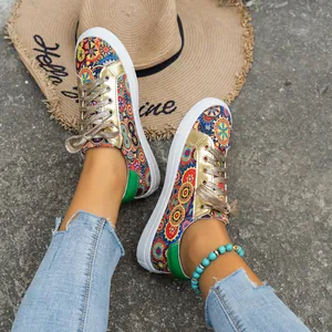 Bohemian printed canvas sneakers for women with gold metallic accents and flat white sole