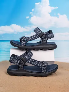 Detailed view of boys' navy blue outdoor sandals with adjustable straps and soft soles.
