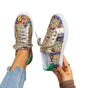 Vibrant mandala print canvas sneakers for women with stylish gold metallic trim details.
