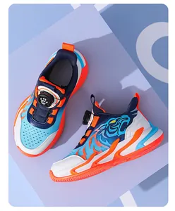 Close-up of boys sports sneakers with rotating buckle and blue tiger pattern.