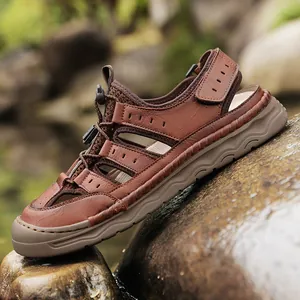 Men's outdoor leather sandals with breathable mesh and quick-tie laces on natural rocks