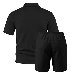Detailed back view of men's black textured jacquard polo shirt and matching shorts set