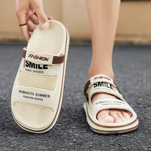 Close-up of men's cream casual outdoor slippers with 'SMILE' and 'FASHION' prints