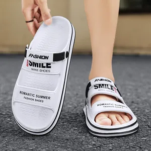 Close-up of white outdoor men's casual slides with black strap details and comfort fit
