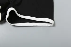 Detailansicht der hochwertigen schwarzen Ripp-Shorts mit weißem Kontrastbesatz