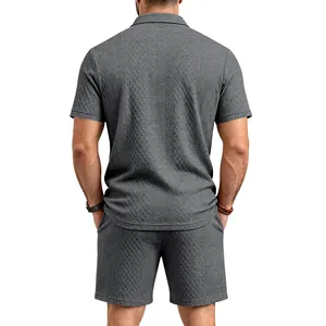 Back view of men's gray jacquard polo shirt and shorts set with textured pattern
