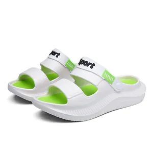 Close-up of white and neon green outdoor sandals featuring 'Sport' text on the straps