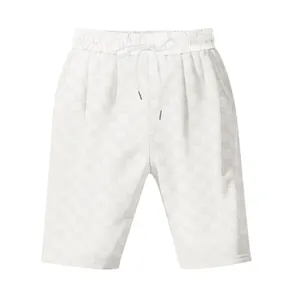 Detail showing white checkerboard jacquard pattern on men's loose casual shorts