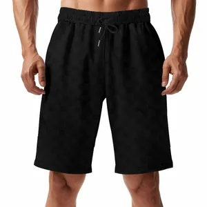 Close-up of black jacquard checkerboard pattern on men's casual shorts