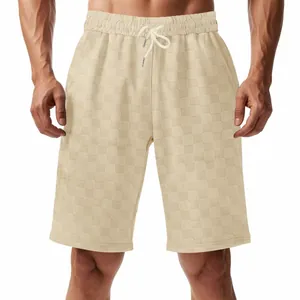 Detailed view of the heavy jacquard checkerboard texture on these casual beige men's shorts
