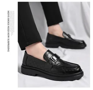 Detail view of breathable black leather loafers with stylish perforated design for men