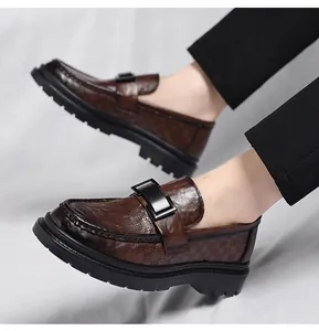 Close-up of premium men's brown breathable hollow-out loafers featuring buckle detail