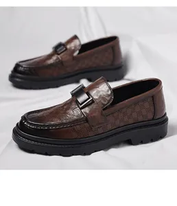 Detailed view of brown breathable perforated leather loafers with metal buckle