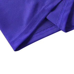 Detailed close-up of stitching and breathable mesh fabric on a purple polo shirt