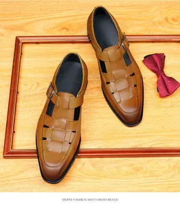 Detailed macro view of men's brown woven leather sandals with adjustable buckle