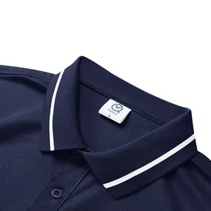 Close-up detail of a quick-dry navy polo shirt collar with white stripes and tag