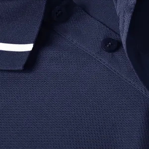 Close-up of dark blue quick-dry polo shirt collar and breathable mesh fabric texture.