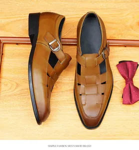 Macro view of brown leather woven Roman sandals for men featuring stylish buckle straps
