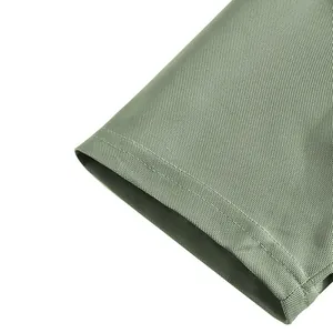 Macro detail of breathable men's golf Polo shirt sleeve cuff with fine stitching and mesh texture