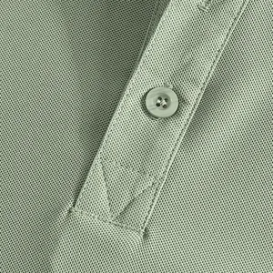 Close-up of men's polo shirt showing breathable piqué fabric and button placket.